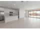 Spacious living area with an open layout to the kitchen and dining area at 18225 W Hess St, Goodyear, AZ 85338