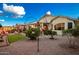 Landscaped backyard with grassy area and desert landscaping at 18258 W Spencer Dr, Surprise, AZ 85374