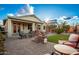 Outdoor seating area with brick patio and view of backyard at 18258 W Spencer Dr, Surprise, AZ 85374