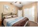 Bright bedroom with a comfortable bed and large closet at 18258 W Spencer Dr, Surprise, AZ 85374