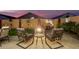 Relaxing patio with fire pit and comfortable seating at 18258 W Spencer Dr, Surprise, AZ 85374