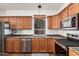 Kitchen features stainless steel appliances and wood cabinets at 18258 W Spencer Dr, Surprise, AZ 85374