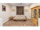 Cozy living room featuring a futon and wooden cabinet at 18258 W Spencer Dr, Surprise, AZ 85374