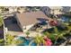 Aerial view showing house, pool, putting green, and surrounding homes at 1893 E San Carlos Pl, Chandler, AZ 85249