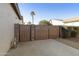 Private backyard access with a wood and metal gate at 1893 E San Carlos Pl, Chandler, AZ 85249