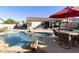 Inviting backyard oasis with a sparkling pool and patio area at 1893 E San Carlos Pl, Chandler, AZ 85249