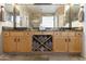 Double vanity with granite countertop and wood cabinets at 1893 E San Carlos Pl, Chandler, AZ 85249