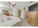 Main bedroom with ensuite bathroom access and large TV at 1893 E San Carlos Pl, Chandler, AZ 85249