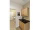 Bright laundry room with cabinets and granite countertop at 1893 E San Carlos Pl, Chandler, AZ 85249