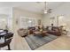 Relaxing living room featuring hardwood floors, a ceiling fan, and comfortable seating at 1893 E San Carlos Pl, Chandler, AZ 85249