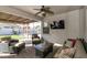 Relaxing covered patio with seating area and ceiling fan at 1893 E San Carlos Pl, Chandler, AZ 85249