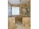 Large walk-in shower with tiled walls and glass enclosure at 1893 E San Carlos Pl, Chandler, AZ 85249