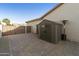 Spacious side yard with storage shed and brick pavers at 1893 E San Carlos Pl, Chandler, AZ 85249