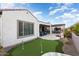 Landscaped backyard with putting green and patio at 19027 N 269Th Dr, Buckeye, AZ 85396