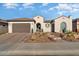 Well-maintained home with attractive landscaping and a welcoming entryway at 19027 N 269Th Dr, Buckeye, AZ 85396