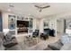 Bright and airy living room with built-in shelving and fireplace at 19027 N 269Th Dr, Buckeye, AZ 85396