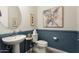 Stylish powder room, featuring a pedestal sink and art at 19027 N 269Th Dr, Buckeye, AZ 85396