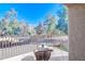 Private balcony with wicker patio furniture and views of the community at 1905 E University Dr # 207, Tempe, AZ 85288