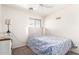 Inviting bedroom featuring soft natural light, carpet, and a ceiling fan at 222 S 223Rd Dr, Buckeye, AZ 85326