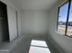 Bright bedroom features a window, closet, and electrical outlets, ready for furnishings at 22844 E Lords Way, Queen Creek, AZ 85142