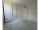 Bright bedroom featuring a double door closet and neutral tones, offering a versatile space at 22844 E Lords Way, Queen Creek, AZ 85142