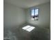 Well-lit bedroom showcasing a large window and fresh white walls, awaiting personalization at 22844 E Lords Way, Queen Creek, AZ 85142