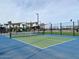 Outdoor pickleball court with blue and green surface at 22844 E Lords Way, Queen Creek, AZ 85142