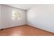 Simple bedroom with tile flooring and window at 2407 W Laurel Ln, Phoenix, AZ 85029