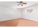 Bright bedroom with tile floors, ceiling fan and window blinds at 2407 W Laurel Ln, Phoenix, AZ 85029