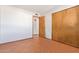 Bright bedroom featuring tile floors and double doors to closet at 2407 W Laurel Ln, Phoenix, AZ 85029