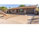 Front view of a single story home with a driveway at 2407 W Laurel Ln, Phoenix, AZ 85029