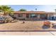 Ranch style home with desert landscaping and a two-car garage at 2407 W Laurel Ln, Phoenix, AZ 85029