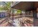 Covered patio with tile flooring, offering shade and outdoor space at 2407 W Laurel Ln, Phoenix, AZ 85029