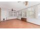 Sunroom with tile flooring, ceiling fan, and window blinds at 2407 W Laurel Ln, Phoenix, AZ 85029