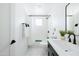 Clean bathroom, featuring a white subway tile shower and modern vanity at 2816 E Cholla St, Phoenix, AZ 85028