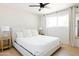 Bedroom with king-size bed, ceiling fan, and light wood nightstands at 2816 E Cholla St, Phoenix, AZ 85028