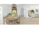 Light-filled dining room with a large wooden table and hanging wicker light at 2816 E Cholla St, Phoenix, AZ 85028