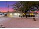 Single story home with modern facade, landscaped yard, and desert landscaping at 2816 E Cholla St, Phoenix, AZ 85028