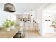 Bright white kitchen with island, stainless steel appliances, and stylish backsplash at 2816 E Cholla St, Phoenix, AZ 85028