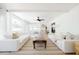 Spacious living area with light colored sofas, a coffee table, and large windows at 2816 E Cholla St, Phoenix, AZ 85028