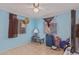 Bedroom with tiled floors, window, and a ceiling fan at 2817 W Marshall Ave, Phoenix, AZ 85017