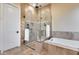 Spa-like bathroom with walk-in shower and soaking tub at 28370 N 113Th Way, Scottsdale, AZ 85262