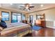 Bright bedroom with access to a private balcony and hardwood floors at 28370 N 113Th Way, Scottsdale, AZ 85262