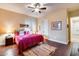 Bright bedroom featuring a comfortable bed and wood floors at 28370 N 113Th Way, Scottsdale, AZ 85262