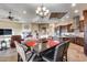 Elegant dining area with a large square table and seating for six at 28370 N 113Th Way, Scottsdale, AZ 85262