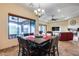 Bright dining area with a large table, seating for six, and views to the backyard at 28370 N 113Th Way, Scottsdale, AZ 85262