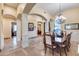 Formal dining room features a large wood table and plenty of natural light at 28370 N 113Th Way, Scottsdale, AZ 85262