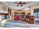 Bright and airy living room features comfortable seating and a fireplace at 28370 N 113Th Way, Scottsdale, AZ 85262