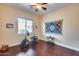 Home office with exercise bike and hardwood floors at 28370 N 113Th Way, Scottsdale, AZ 85262