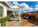 Relaxing backyard with a pergola, patio furniture, and lush landscaping at 2963 E Birdsong Ave, San Tan Valley, AZ 85143